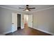 Bedroom with wood floors, natural light, ceiling fan, and closet at 3164 Harris Dr, East Point, GA 30344