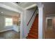 Entryway with hardwood stairs, access to kitchen, and hardwood flooring at 3164 Harris Dr, East Point, GA 30344