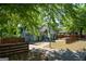Charming cottage-style home with a well-manicured front lawn, driveway, and wooden fence at 3164 Harris Dr, East Point, GA 30344