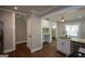 Well-lit kitchen featuring new cabinets, flooring, and stainless steel appliances at 3164 Harris Dr, East Point, GA 30344