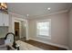 Bright kitchen with granite countertops, stainless steel sink, and view into the living area with fireplace at 3164 Harris Dr, East Point, GA 30344