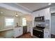 Modern kitchen showcasing stainless steel appliances, and bright white cabinetry at 3164 Harris Dr, East Point, GA 30344