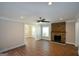 Spacious living room with hardwood floors, stacked stone fireplace, and lots of light at 3164 Harris Dr, East Point, GA 30344