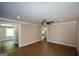 Spacious living room featuring hardwood floors, neutral walls, and large windows at 3164 Harris Dr, East Point, GA 30344