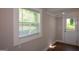 An additional room featuring a bright window and back door at 3164 Harris Dr, East Point, GA 30344