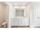 Bright bathroom with double sink vanity and wood-look flooring at 1020 Sutherland Lane # 41, Lawrenceville, GA 30043