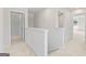 A bright hallway with carpet flooring and neutral-colored walls leading to multiple rooms at 1020 Sutherland Lane # 41, Lawrenceville, GA 30043
