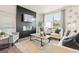 Comfortable living room features a modern fireplace, TV, and lots of natural light at 1020 Sutherland Lane # 41, Lawrenceville, GA 30043