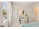 Bright bedroom featuring a desk near the window and a glimpse into a walk-in closet at 1028 Sutherland Lane # 45, Lawrenceville, GA 30043