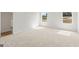 Bright bedroom with a neutral carpet and two windows at 1028 Sutherland Lane # 45, Lawrenceville, GA 30043