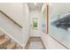 Inviting entryway with a staircase, stylish artwork, and a view of the front door at 1028 Sutherland Lane # 45, Lawrenceville, GA 30043