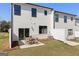 Backyard patio with a table and chairs and a view of the yard at 1028 Sutherland Lane # 45, Lawrenceville, GA 30043