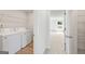 Laundry room features white washer and dryer next to the doorway at 1028 Sutherland Lane # 45, Lawrenceville, GA 30043