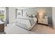 Calm main bedroom with decorative wall art and bright natural light at 1028 Sutherland Lane # 45, Lawrenceville, GA 30043