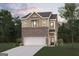 New construction two-story home features a brick and siding exterior with an attached two-car garage at 1032 Sutherland Lane # 47, Lawrenceville, GA 30043