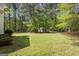 Large backyard offering ample space for outdoor activities with storage shed at 12843 Simmons Rd, Hampton, GA 30228