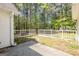 Fenced-in backyard featuring mature trees and landscaping, offering a private outdoor space at 12843 Simmons Rd, Hampton, GA 30228