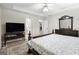 Bedroom with tray ceiling, carpet, and view to bathroom at 12843 Simmons Rd, Hampton, GA 30228