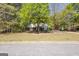 Traditional style home with mature trees in a large yard at 12843 Simmons Rd, Hampton, GA 30228