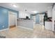 Bright kitchen featuring white cabinets and tiled floor at 12843 Simmons Rd, Hampton, GA 30228