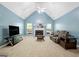 Spacious living room with vaulted ceiling, fireplace, and large windows at 12843 Simmons Rd, Hampton, GA 30228