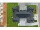 Aerial view of a well-manicured home with a spacious driveway and vibrant green lawns at 576 Silver Moon Dr, Loganville, GA 30052