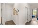 Hallway with hardwood floors and a view to a bedroom and closet at 576 Silver Moon Dr, Loganville, GA 30052