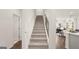 Bright stairway with views to the living room at 576 Silver Moon Dr, Loganville, GA 30052