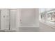 Bathroom with a tub and shower at 335 Silver Moon Dr, Loganville, GA 30052