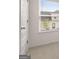 Bright bedroom with a window and views of the neighborhood featuring neutral carpeting at 335 Silver Moon Dr, Loganville, GA 30052