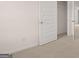 Bedroom features neutral carpet and paint plus a closet and doorway for seamless flow at 335 Silver Moon Dr, Loganville, GA 30052