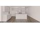 Bright kitchen featuring an island, neutral cabinets, and modern appliances at 335 Silver Moon Dr, Loganville, GA 30052