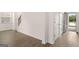 Bright living room with hardwood floors, neutral paint, with a staircase and entry door at 335 Silver Moon Dr, Loganville, GA 30052