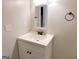 Bathroom featuring modern white vanity with square sink, bronze fixtures and a mirror at 674 Jett Nw St, Atlanta, GA 30318