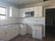 Updated kitchen featuring white cabinets, stainless steel appliances, and modern countertops at 674 Jett Nw St, Atlanta, GA 30318