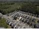 Aerial view of a residential neighborhood showcasing the layout and proximity to green spaces and roadways at 7756 Newbury Dr, Jonesboro, GA 30236