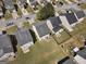Aerial view of homes showing roof details and backyard spaces within a residential community at 7756 Newbury Dr, Jonesboro, GA 30236
