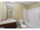 Bathroom featuring a vanity sink, toilet, and a shower-tub combination at 7756 Newbury Dr, Jonesboro, GA 30236