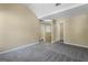 Spacious carpeted bedroom features lots of natural light and neutral paint at 7756 Newbury Dr, Jonesboro, GA 30236