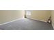 Bedroom with plush carpet and neutral walls; ready for personalization and comfort at 7756 Newbury Dr, Jonesboro, GA 30236
