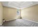 Bedroom featuring a trey ceiling, natural light, neutral walls, and carpeted floor at 7756 Newbury Dr, Jonesboro, GA 30236
