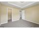 Bedroom featuring a trey ceiling, natural light, neutral walls, and carpeted floor at 7756 Newbury Dr, Jonesboro, GA 30236