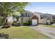 Charming two-story home with attached garage and well-maintained landscaping in a friendly neighborhood setting at 7756 Newbury Dr, Jonesboro, GA 30236