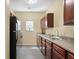 Functional kitchen with dark wood cabinets, and stainless steel appliances at 7756 Newbury Dr, Jonesboro, GA 30236