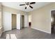 Serene main bedroom with an adjoining bathroom, gray floors and closet space at 7756 Newbury Dr, Jonesboro, GA 30236