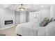Bedroom featuring fireplace, hardwood flooring, and view into updated bath at 474 Autumn Dr, Riverdale, GA 30274
