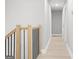 Hallway with neutral decor and hardwood floors and stairs at 474 Autumn Dr, Riverdale, GA 30274
