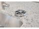 Modern bar sink with glass rinser set into a light speckled stone countertop at 5389 Tolar Road # 36, South Fulton, GA 30213