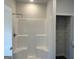 Modern shower with built-in seating and a storage closet with wire shelving at 5360 Tolar Rd # 72, South Fulton, GA 30213