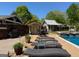 Expansive backyard with inground pool, loungers, grill, and ample space for outdoor activities at 363 Palmetto Rd, Tyrone, GA 30290